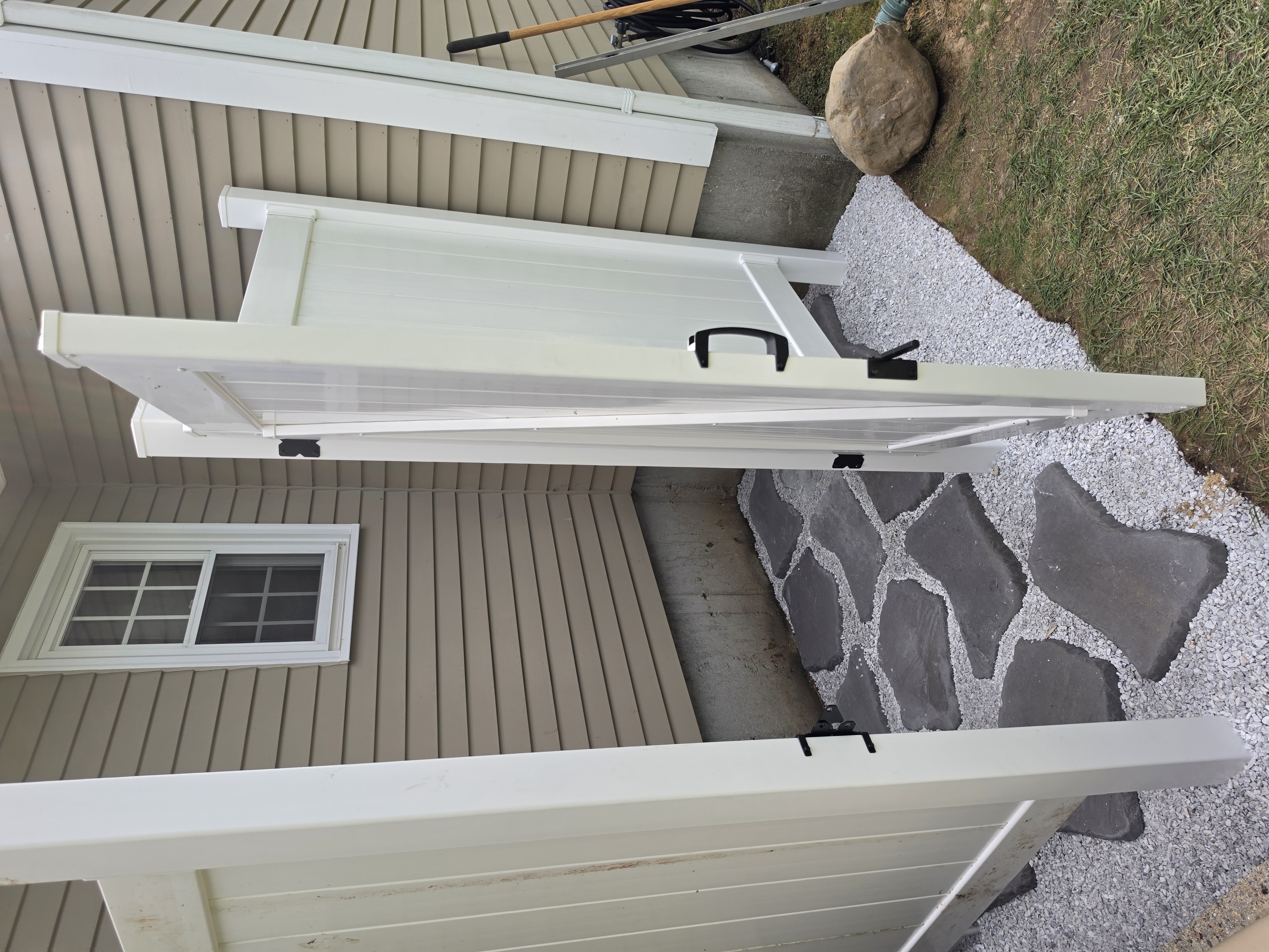 Outdoor shower with slate stepping stones